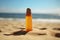 close-up of sunscreen bottle on sandy beach
