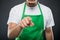 Close-up of supermarket employer pointing camera