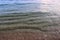 Close up surface of floating water with ripples and waves and some reflections