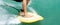 Close up of a surfers lower legs and feet