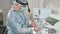 Close-up, surgeon working in the hospital disinfects the medical instruments before the operation. Doctor in glasses