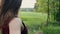Close-up of swaying womans hair. Woman running in the nature. Back view, slow mo, steadicam shot