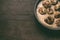 Close up of swedish chicken traditional meatballs in pan on dark rustic wooden background, top view