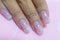 Close up Sweet beautiful pink and silver glitter ombre style gel nail art painting cute White snowflake