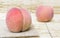 Close up of sweet fresh pink Peach on burlap wooden background, Blurred photo,Autumn healty fruit concept