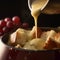 Close-up of Swiss Fondue with Bread, Potatoes, and Apples