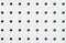 Close-up of symetrical holes on a white pegboard