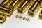 Close-up of symmetric aligned gold plated uFL micro precision radio connector in partial focus white and SMA background