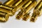 Close-up of symmetric aligned gold plated uFL, MMCX micro precision radio connector partial focus white SMA background