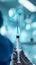 Close-up of syringe with needle in doctor hands against blurred hospital backdrop. Cosmetic injection. Generative AI