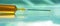 Close-up of syringe with needle filled with golden yellow fluid for vaccine or vaccination concept medical background. Global