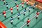 Close-up of Table football soccer game on green field baby foot