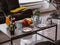 Close-up of table. Leather sofas. Plates and glasses. Fruits on plate.