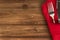 Close up on table settings with a red napkin and a cutlery.