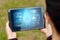 Close-up of a tablet in hands depicting a medical technology hologram graphics. medicine of modern times. Copy space