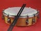 Close-up of a tamborim and drumstick, a Brazilian percussion musical instrument.