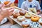 Close-up of tasty baked donuts with glazing and berries in sunlight.Bokeh