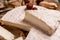 Close up Tasty cheese with nuts on linen napkin wooden background copy space cheese knives. National Italian French Camembert or