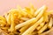 Close up Tasty French fries or potato fry  with salt served in a wooden basket.Fastfood