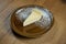 Close up on tasty slice of Delicate Airy Cheesecake on wooden background. delicious dessert cake after dinner. Food photo