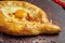 Close up on tasty traditional Adjarian Khachapuri - open baked pie with melted salt cheese suluguni and egg yolk on wooden tray