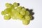 Close up of tasty whine grapes on white background