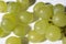 Close up of tasty whine grapes on white background