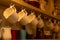 Close Up of Tea Cups Hanged on the Cupboard in English Cottage in Countryside