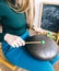 Close-up of a teacher on playing the glucophone. Playing on steel tongue drum. The concept of providing services for meditation,