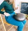 Close-up of a teacher on playing the glucophone. Playing on steel tongue drum. The concept of providing services for meditation,