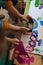 Close-up of teacher showing picture on smartphone to kids during creative art and craft class at school