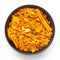 Close up of Teekha Meetha crunchy spicy Indian namkeen snacks on a ceramic black bowl.