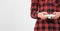 Close up of teenage boy hands playing video games holding a joystick console isolated over white background with copy space.