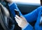 Close-up of a teenager sending a text in her car