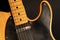 Close up of a Telecaster natural electric guitar