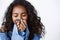 Close-up tender, romantic curly-haired african american woman holding hands near mouth and close eyes from happiness