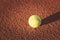 Close up of tennis ball on clay court./Tennis ball , vintage