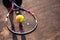 Close-up of tennis ball on racket in hands of player.