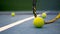 Close up of tennis equipment on the court. Sport, recreation concept.