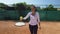 Close-up on tennis player balancing ball on racket