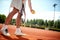 Close up of tennis playerâ€™s legs serving