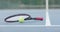Close up of tennis racket and ball on outdoor tennis court, slow motion