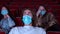 Close up of terrified young man wearing medical mask while watching movie at the cinema. Media. Portrait of a handsome