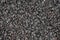Close up texture background wallpaper of a set of grey sharp pebbles stones