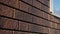 Close-up of texture of brick wall. Siding made of plastic imitation of stone