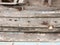 Close up texture of decaying wooden boat with rusty nails