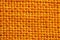 Close-up of texture fabric. Orange cloth textile background. Mac