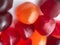 Close-up texture of red, orange and purple multivitamin gummies. Healthy lifestyle concept