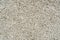 Close-up of texture of small stones or gravel. Concrete surface with copy space. Construction and building concept. Fine gravel