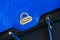 Close-up texture of vivid fashion blue color handbag, genuine leather with embossed under the skin of Ostrich, gold lock